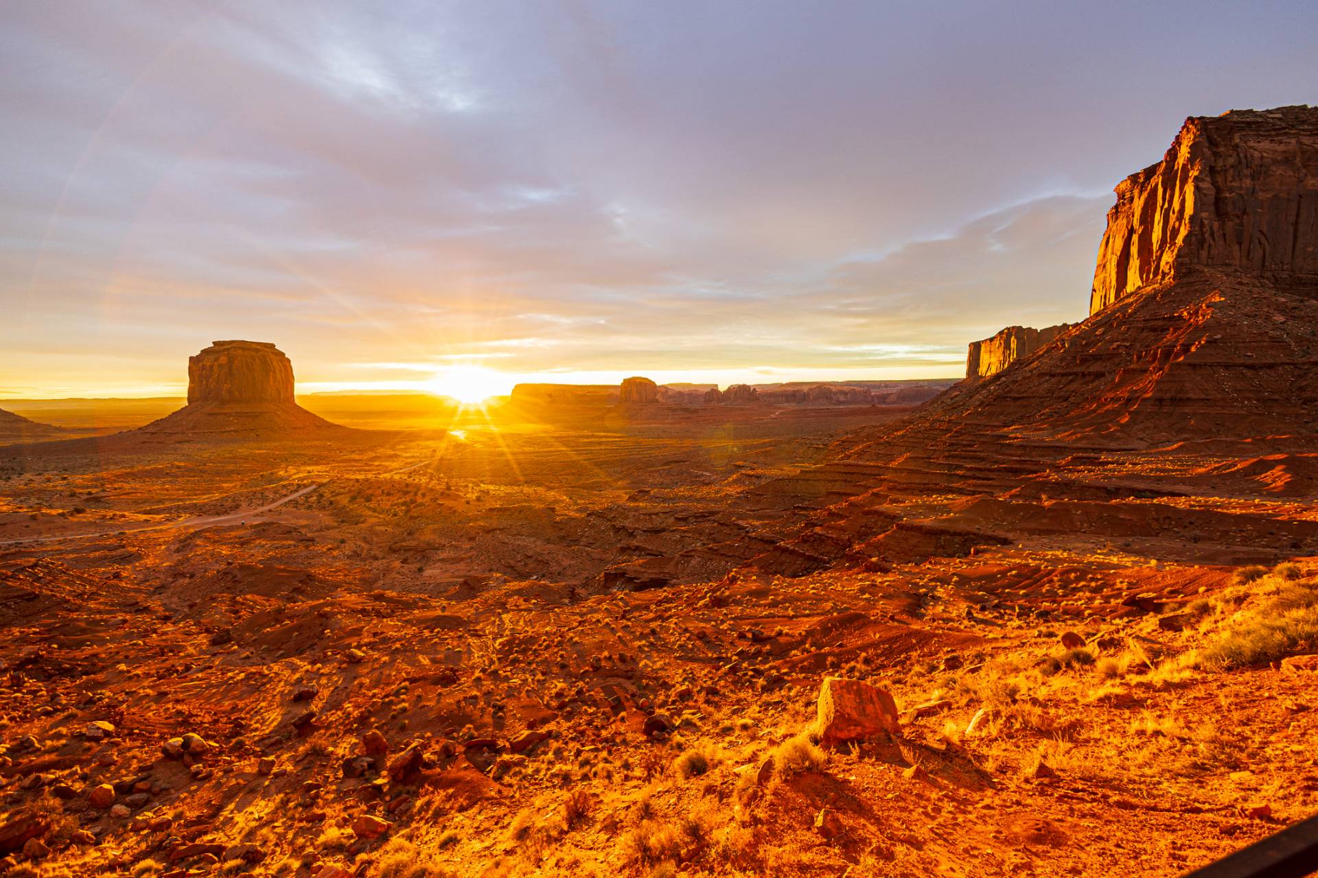 Sunrise over red rock buttes and mesas in Monument Valley, Arizona