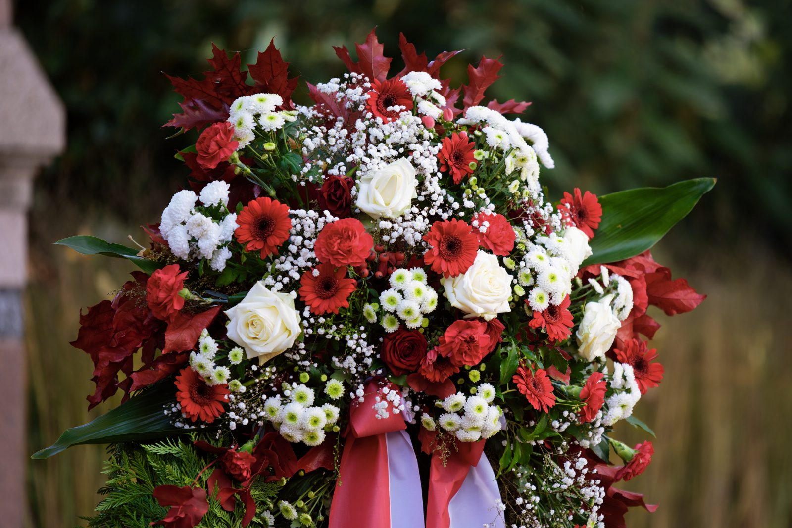 Funeral wreath of red and white roses and carnations
